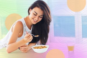 A person eating cereal from a bowl while smiling