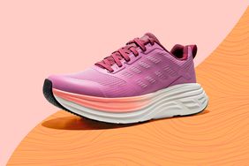 A running sneaker with a thick sole and lace-up design on an abstract background