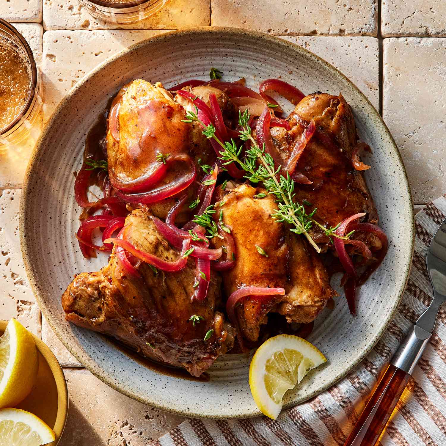 overhead view of Lemon-Balsamic Chicken Thighs served on a ceramic plate
