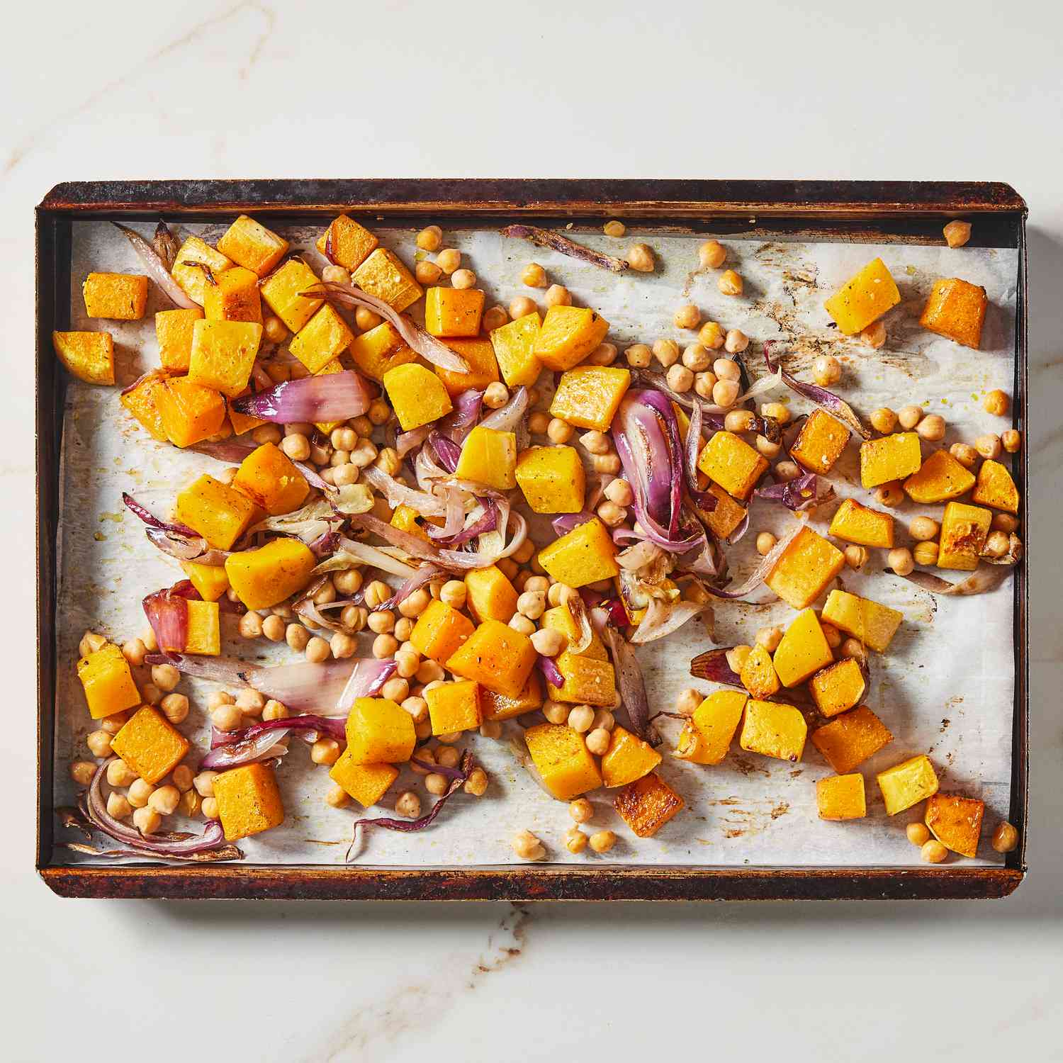 a step in making the Massaged Kale Salad with Roasted Squash & Chickpeas