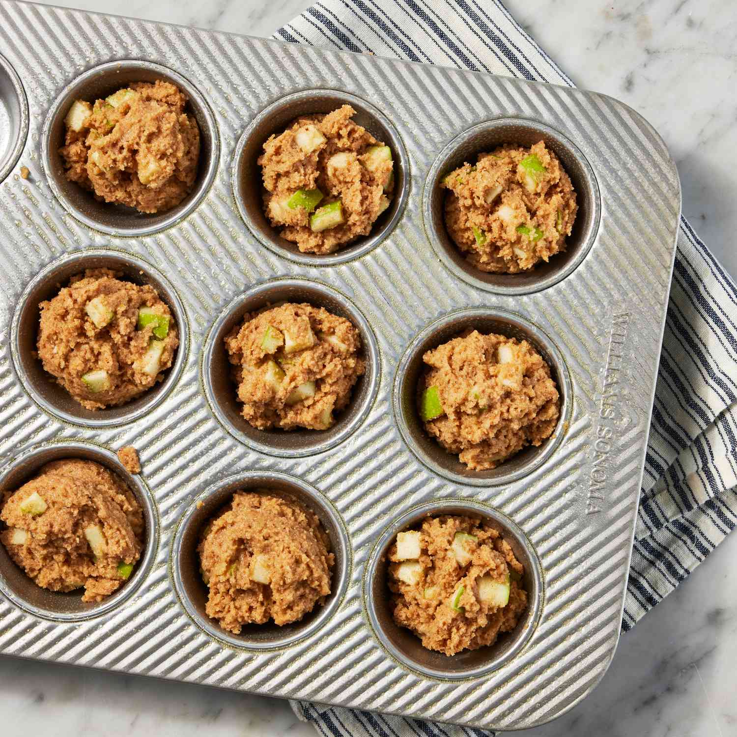 an image of the batter divided into muffin tins