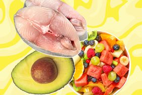 Slices of mackerel fish, an avocado half, and a bowl of mixed fruit