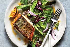 Sautéed Striped Bass With Lemon and Herb Sauce on a white plate