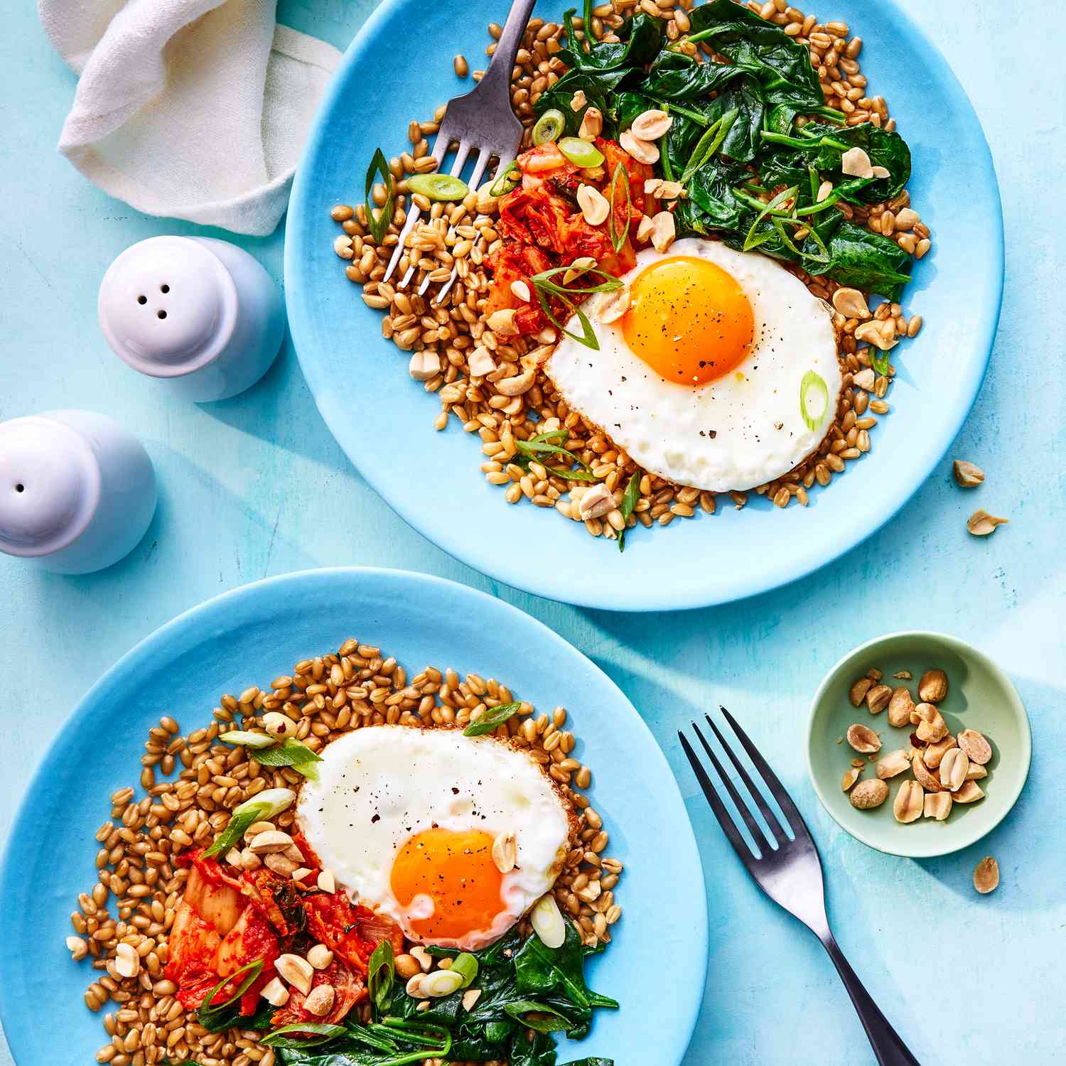 a recipe photo of the Wilted Spinach and Fried Egg Wheat Berry Bowl