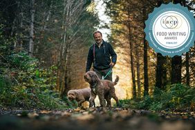 Charles Lefevre and his keen-nosed dogs, Mocha and Dante, hunt for truffles on an old logging road in the Oregon woods, where the fungi grow underneath Douglas fir trees.