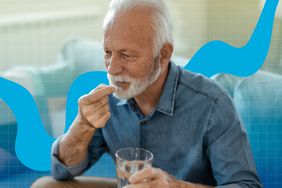 a photo of a man taking a supplement with a glass of water