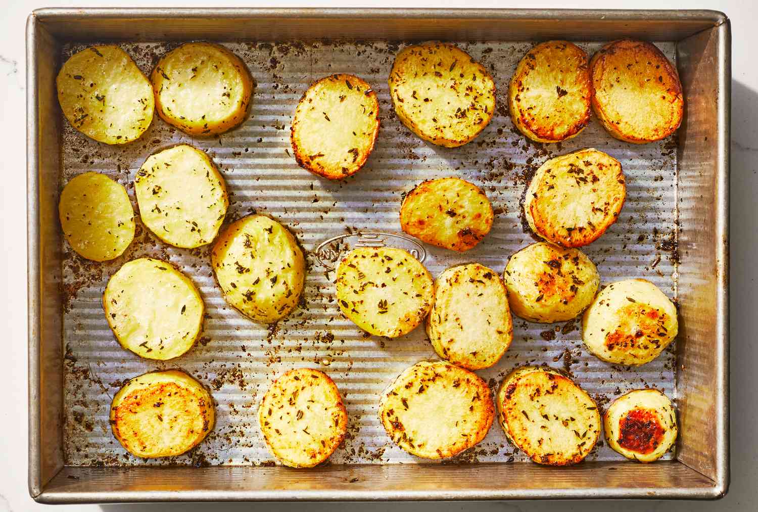 Overhead view of cooked Melting Potatoes recipe in a baking pan