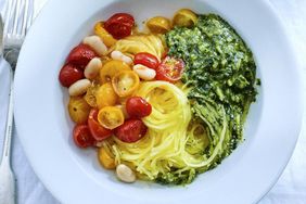 spaghetti squash with roasted tomatoes beans and almond pesto