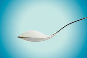 a photo of a spoonful of artificial sweetners