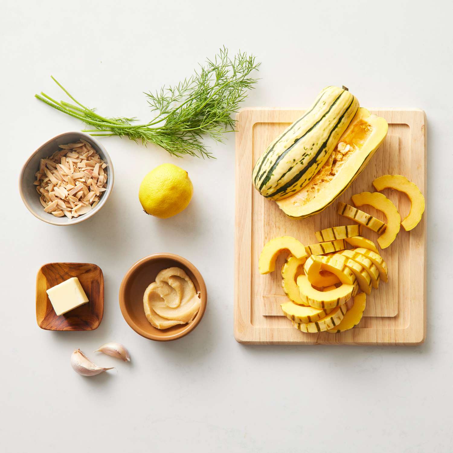 the ingredients to make the Miso-Garlic Butter Roasted Delicata Squash