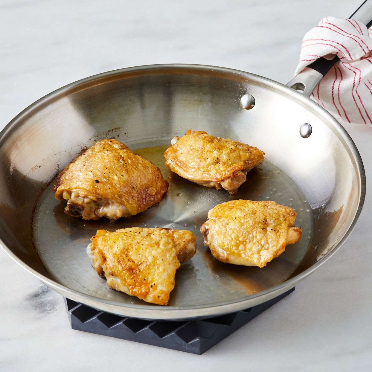 Chicken-thighs-cooking-in-a-skillet