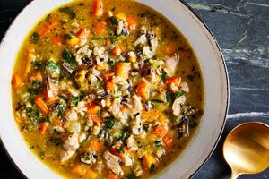 a recipe photo of the Chicken & Root Vegetable Soup with Wild Rice served in a bowl