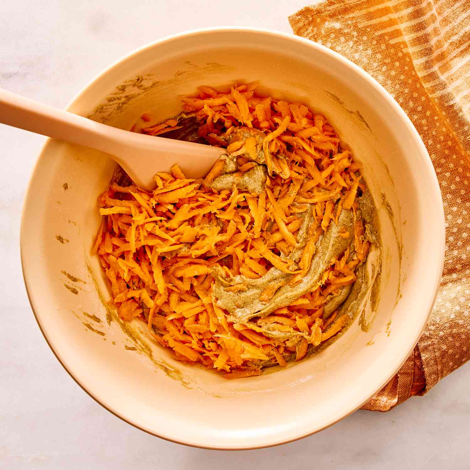an image of the carrots being mixed into the batter