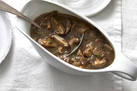 a gravy boat with a ladle