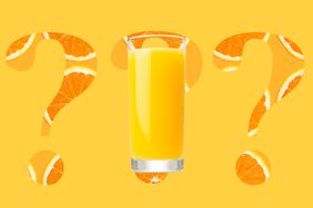 Orange juice on a designed background of question marks