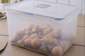 potatoes in a lock food storage container sitting on a counter.