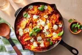 a photo of the Skillet Ravioli Lasagna garnished with basil and ready to serve