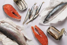 A photo showing a variety of fresh and canned fish from overhead