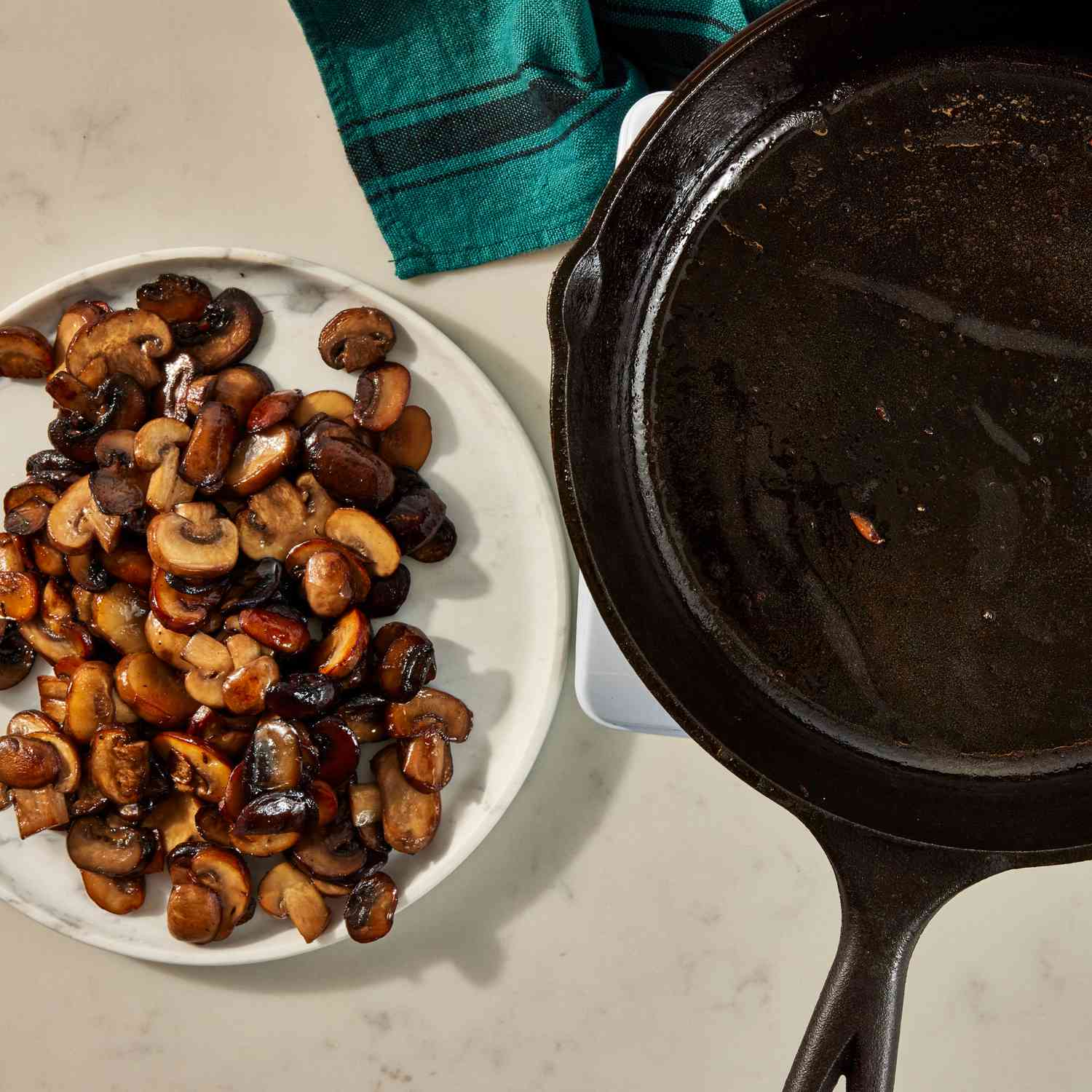an image of the cooked mushrooms being transferred to a plate