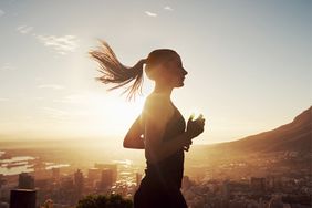 a woman running during sunset