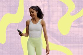 A person walking while holding a smartphone