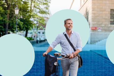 A man standing outdoors holding a bicycle, urban background with abstract circles overlay