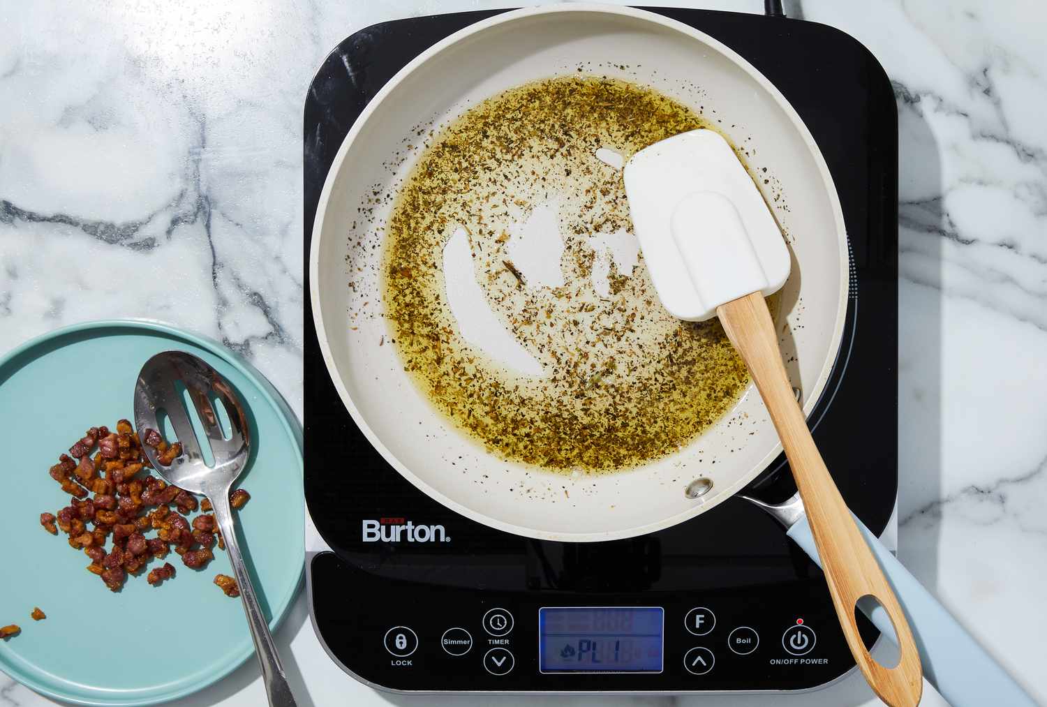 oil seasoned in pan with a spatula