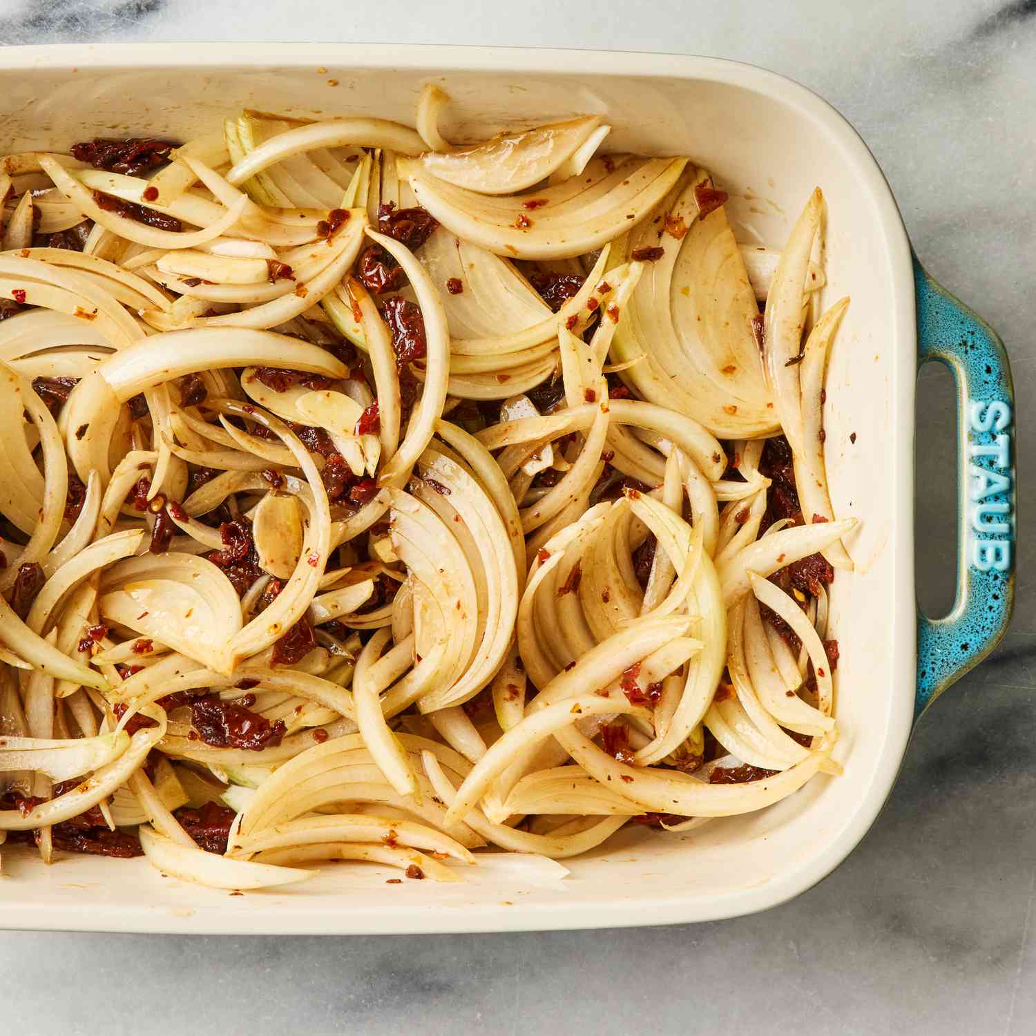 an image of the sliced onions in a baking dish