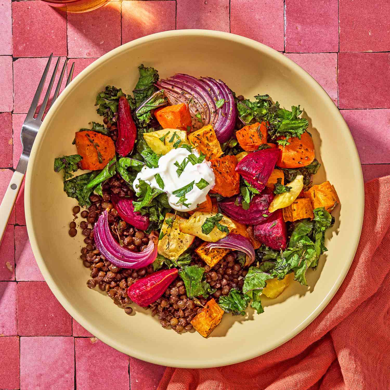 A bowl of Roasted Root Veggies & Greens over Spiced Lentils