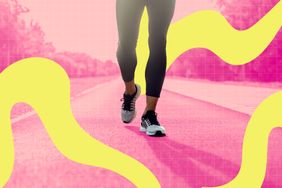 Person walking on a road wearing athletic shoes with abstract yellow patterns