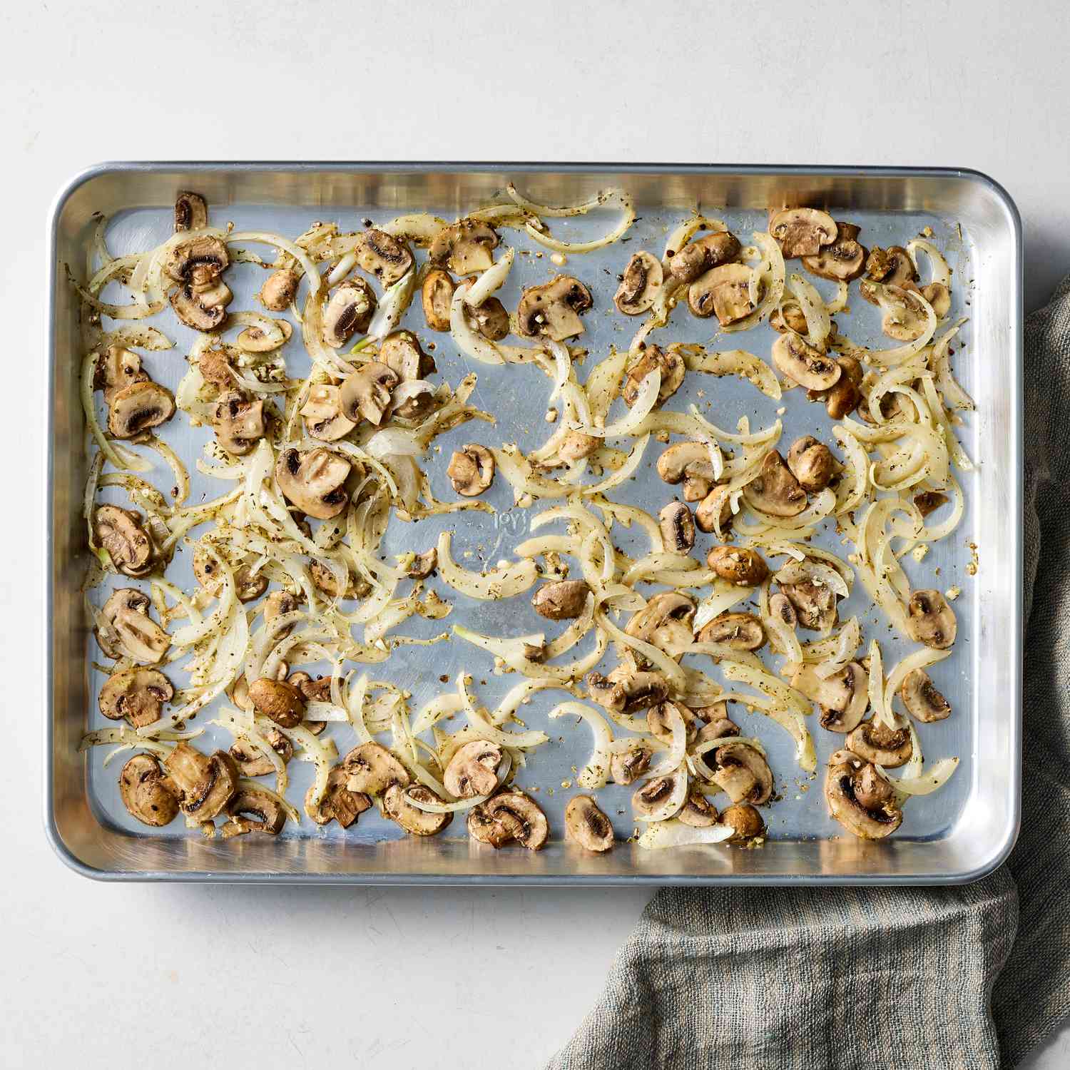 an image of the onions and mushrooms on a baking sheet