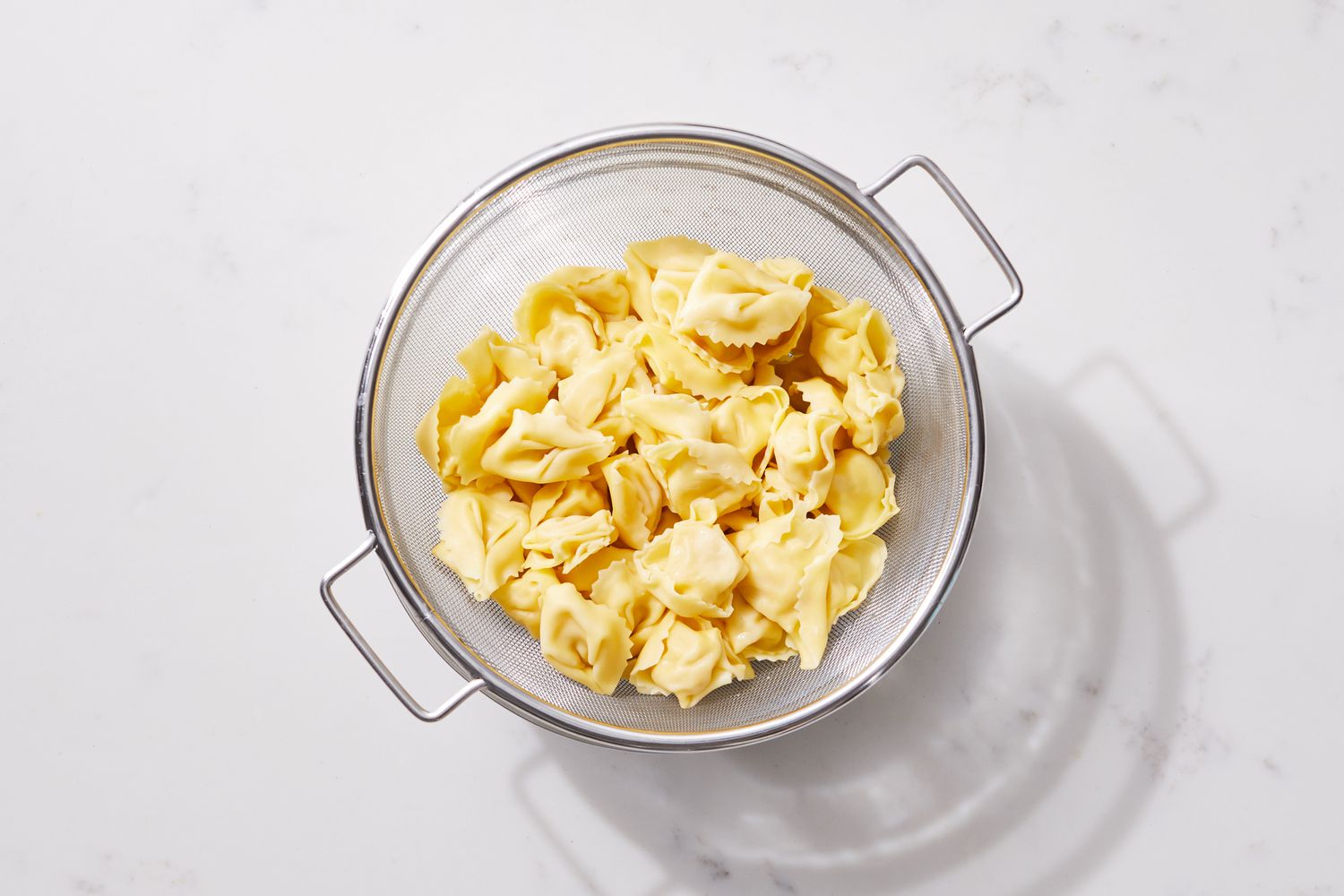 a step in making the Spinach & Tortellini Casserole