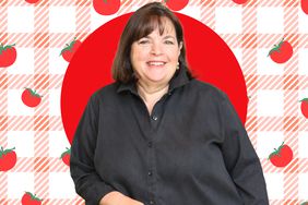 Ina Garten standing against a patterned background, smiling